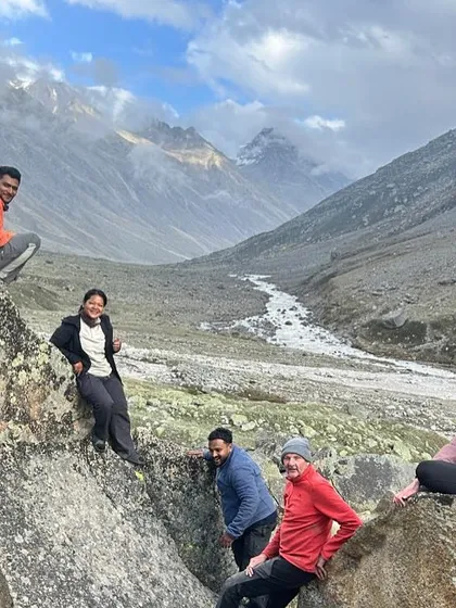 Posing on the unique rock formations in the stark landscape of the Pin valley, after crossing the Pin Parvati Pass.
