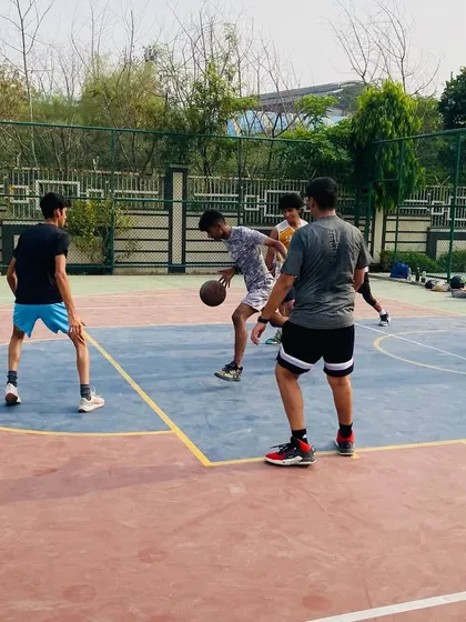 A senior player dribbles past a defender. Advanced ball-handling skills are a key focus for our older group.