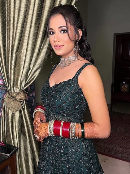 A soft, shimmering, and oh-so-glam reception look. This bride is glowing with nude lips, sparkly eyes, and a touch of blush, perfect for her celebration.