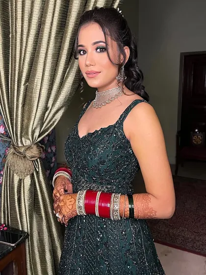 Soft, shimmering, and oh-so-glam. This reception look features nude lips, sparkly eyes, and a touch of blush for that perfect newlywed glow.