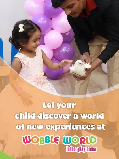 A little girl discovers a world of new experiences, like gently petting a dove from our magic show. These are the moments of wonder we create.
