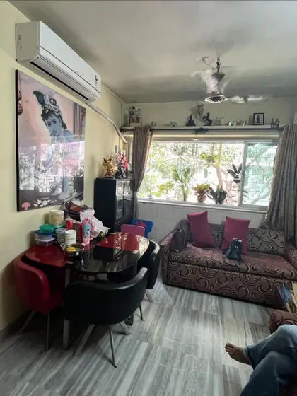 The living room of the Vora House before renovation. The layout was dated, with a small window and cluttered furniture. I saw the potential to create a bright, open, and modern living area.
