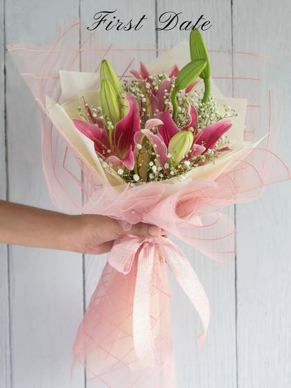 First date? Show up with a beautiful bouquet of pink lilies. It's a classic, thoughtful gesture that speaks from the heart.