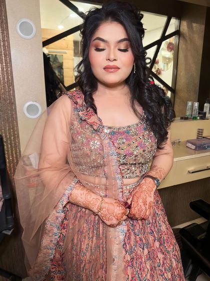 A gorgeous look for her roka ceremony. I created a soft, romantic look with a focus on her eyes and a beautiful, intricate hairstyle.