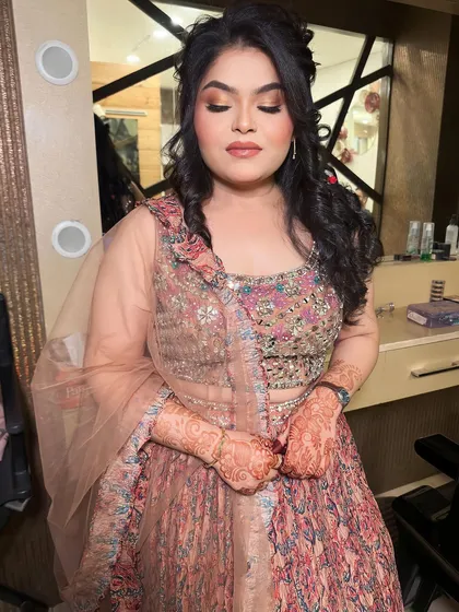 A gorgeous look for her roka ceremony. I created a soft, romantic look with a focus on her eyes and a beautiful, intricate hairstyle.