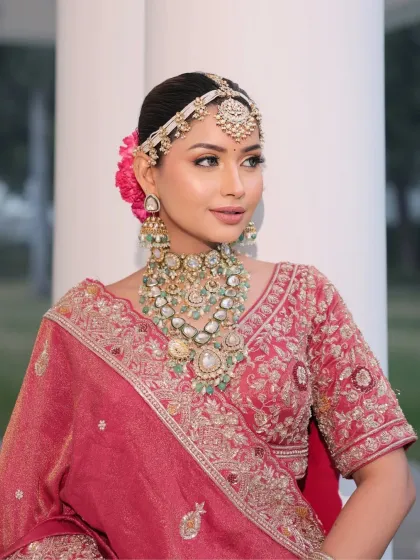 This portrait highlights the elegance of the bride's makeup. The soft, defined eyes and nude-matte lip create a sophisticated look that is both modern and timeless.