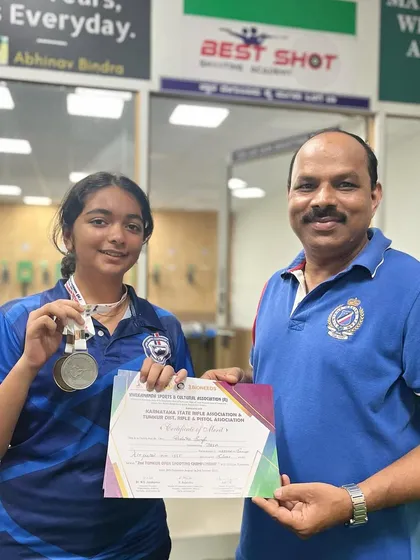 I am pictured here with Rishika, who won both silver and bronze medals at the CBSE South Zone Shooting competition in Kollam, Kerala.