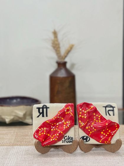 Another view of the anecdotal ceramic tiles, showing how they can be displayed as a unique piece of decor. These custom pottery commissions are perfect for commemorating friendships and special moments.