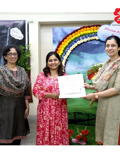 Another proud graduate from our Pune institute receives her certificate in front of her beautiful "Monsoon Magic" final project. It's a joy to see our students' hard work pay off.
