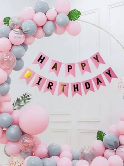 A simple and pretty birthday balloon ring in pastel pink and grey, with a "Happy Birthday" banner.