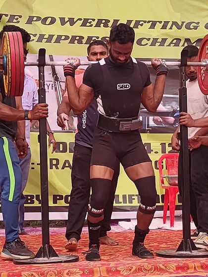 An athlete preparing to squat at the State Meet. The focus and intensity are palpable.
