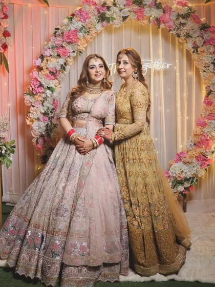 A beautiful bond between sisters. This photo captures a sweet moment between the bride and her sister at the engagement ceremony.