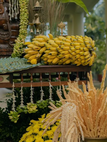 To honor tradition in a modern way, I designed this South Indian wedding decor inspired by temple architecture. The arrangement features auspicious elements like banana bunches and intricate floral garlands, creating a divine and welcoming atmosphere for the ceremony.
