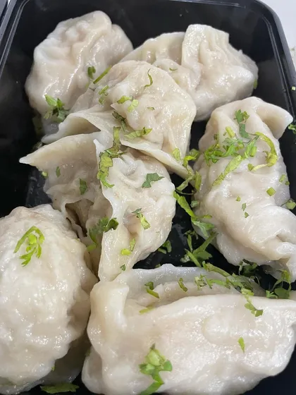 A close-up of my simple and delicious home-cooked Chicken Steam Momos. They have a soft, delicate wrapping and a juicy, flavourful filling, served fresh and hot.