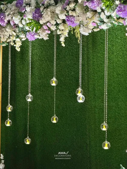 A close-up of the hanging crystal and candle details, adding a touch of sparkle to the photo booth.