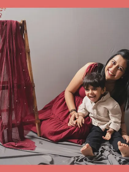 All smiles and giggles on the studio floor. Creating a relaxed and fun atmosphere is key to capturing a toddler's natural, happy expressions.