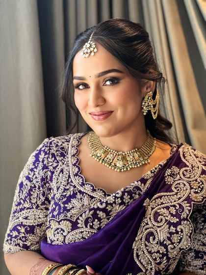 Ruchita's smile did half the work, and her glow did the rest. For her look in this stunning purple saree, we focused on soft glam that matched the warmth of her heart.
