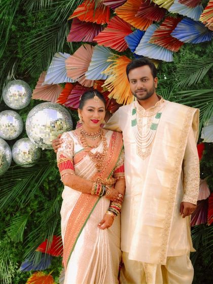 The happy couple. I designed both the bride's traditional saree blouse and the groom's coordinated cream sherwani for their wedding ceremony.