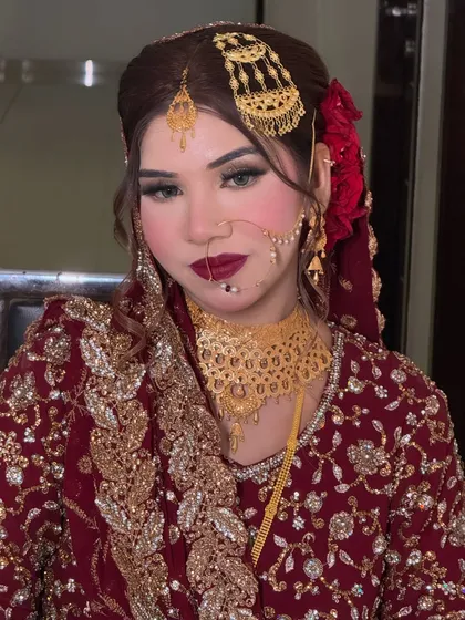 A beautiful portrait of the bride looking directly at the camera. Her confidence shines through, enhanced by the bold and glamorous makeup.