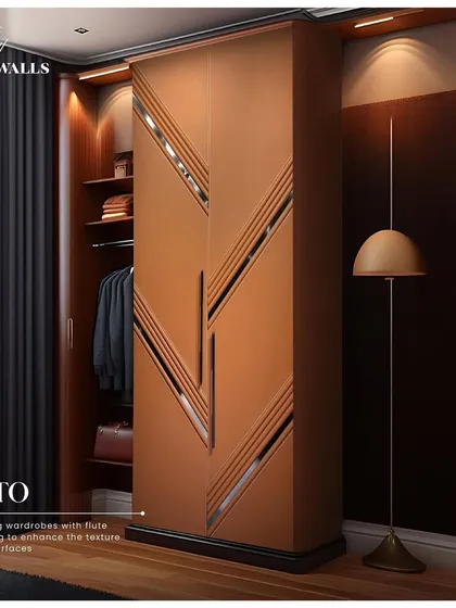 We believe storage should be a statement. For this 'Arto' wardrobe, we used leather fluted paneling with inlaid metal accents to turn a functional piece into a striking design element, enhancing the texture and feel of the surface.