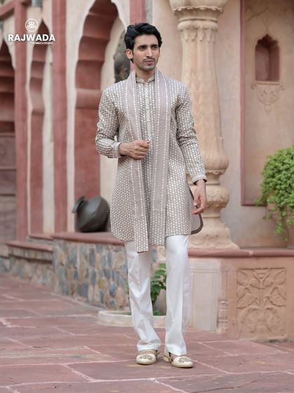 A full-length view of the beige printed kurta set. The clean silhouette and elegant print make it a versatile addition to any ethnic wardrobe, suitable for various festive occasions.