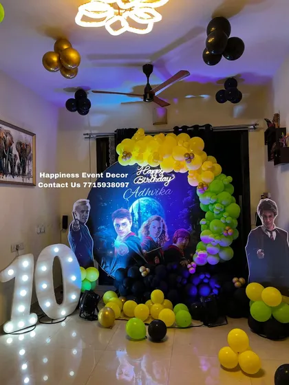 A full view of the Harry Potter themed birthday setup in a home living room. The decor fills the space with magical elements, perfect for any fan.