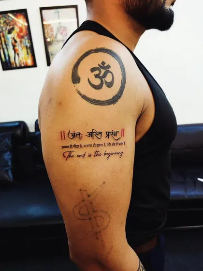 A large upper arm piece featuring the Om symbol and the Sanskrit shloka 'Ant asti prarambh' in both Devanagari and English script.