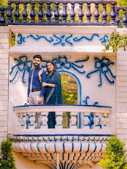 A wide shot of the Santorini-inspired balcony, showcasing its beautiful blue and white design.