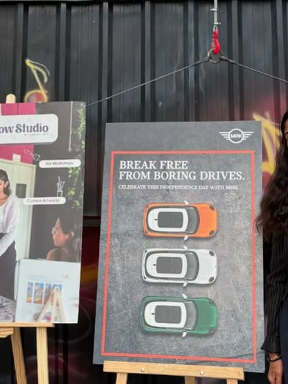 Standing by the display easels at the Mini Cooper event. I love partnering with brands to bring a unique, artistic touch to their experiences.