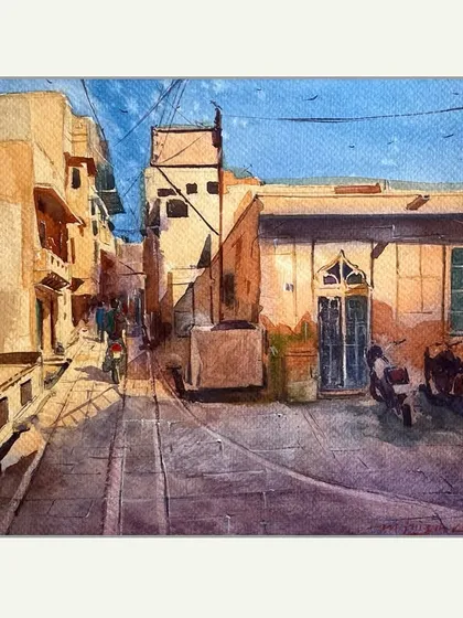 A quick watercolour sketch of a city street. These quick studies are great for capturing the light and shadow of a specific moment, like the sharp afternoon sun creating long shadows in a narrow lane.