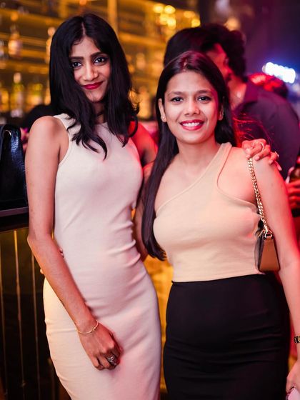 Two friends posing for a photo.