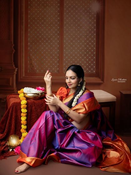 The elegance of traditional Indian jewelry and attire is timeless. This portrait captures the mother-to-be adorning herself, celebrating her beauty and the new life within.
