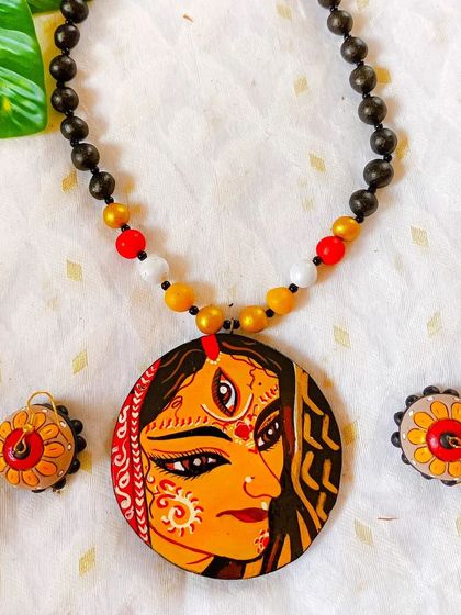 This is another version of my ornate, bridal-style goddess pendant. The intricate details and rich colors make it a standout piece for any festive or special occasion.