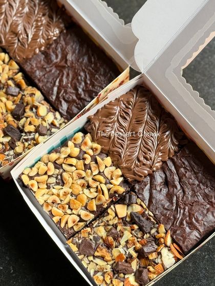 My assorted brownie box, featuring a mix of Nutella-swirled brownies and nut-topped brownies. It's the perfect choice when you can't decide on just one flavor.