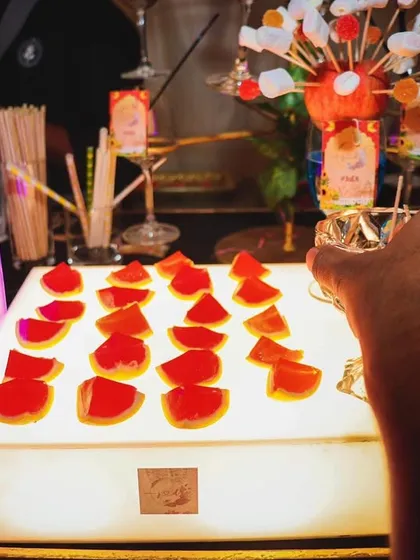 Jello shots are always a party favorite. We present them on a lit-up display, making them an inviting and fun treat for guests.
