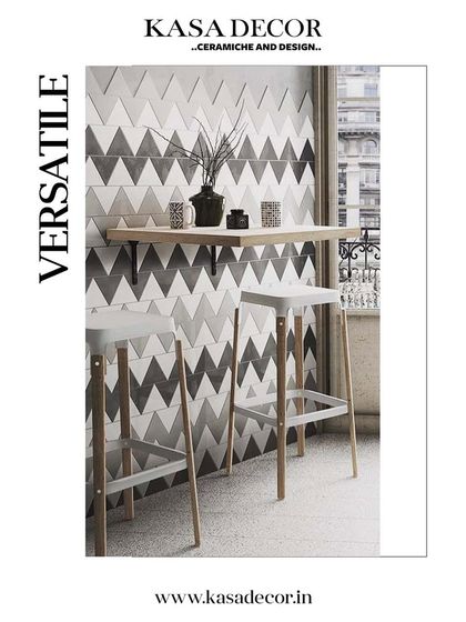 Versatile chevron-patterned tiles in a monochrome palette. Used here as a backsplash in a breakfast nook, they create a modern and graphic statement.