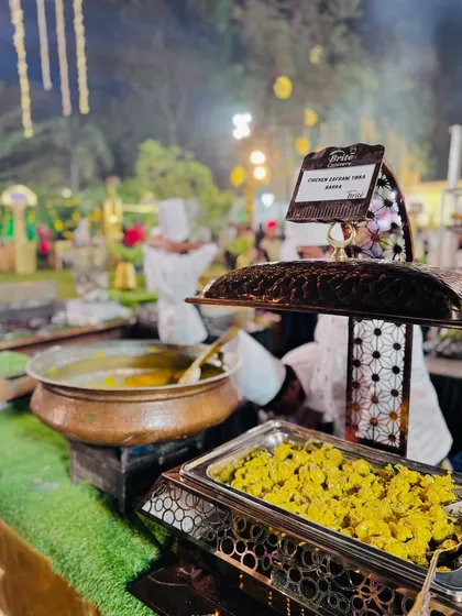 A close-up of the Chicken Zafrani Tikka Barra, showcasing its creamy texture and vibrant yellow color from the saffron.