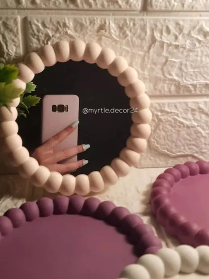 This bubble mirror is one of our most popular designs, and we love seeing it go viral on Pinterest. The bubbly frame is handcrafted from Jesmonite and adds a playful, aesthetic touch to any room.