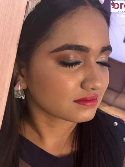 This shot shows the soft, blended eyeshadow and natural-looking lashes that complete this glowing look.