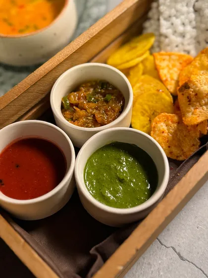 The papad and chutney platter from our Navratri menu. We offer a variety of house-made chutneys with different flavor profiles to accompany the meal.