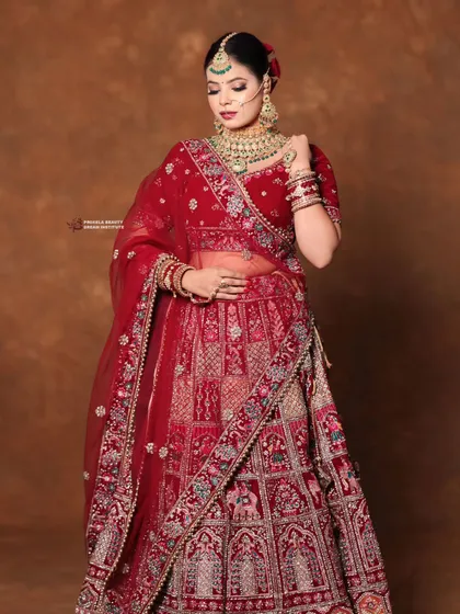 The full-length view shows how the complete look comes together. The makeup perfectly complements the intricate embroidery and heavy jewelry, creating a cohesive royal aesthetic.