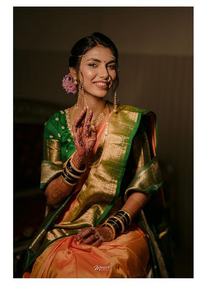A beautiful portrait of the Marathi bride, her smile and traditional attire shining with grace and elegance.