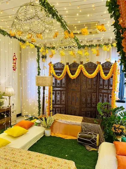 Another look at this beautiful Dholki night decor. The combination of artificial grass, low seating, and sparkling chandeliers transformed the room completely.