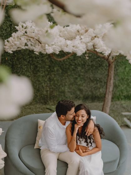 A tender kiss on the cheek captured during a styled couple's photoshoot. These are the simple, loving gestures that tell a beautiful story.