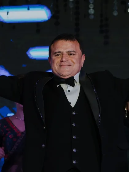 The father of the bride enjoying his moment in the spotlight. We make sure parents feel celebrated and have a great time.