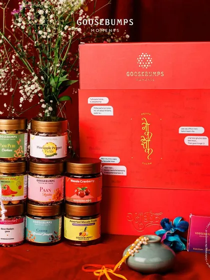 A full view of the massive Raksha Bandhan gift box, overflowing with treats like Rose Badam Mukhwas, Masala Cranberry, and Pani Puri Cashews. It’s a gift that truly captures the sweet and savoury nature of sibling bonds.