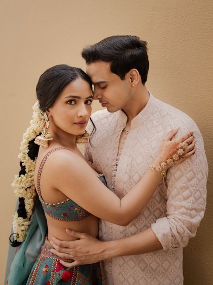 An intimate couple portrait from the Haldi ceremony. Both bride and groom look relaxed and happy.