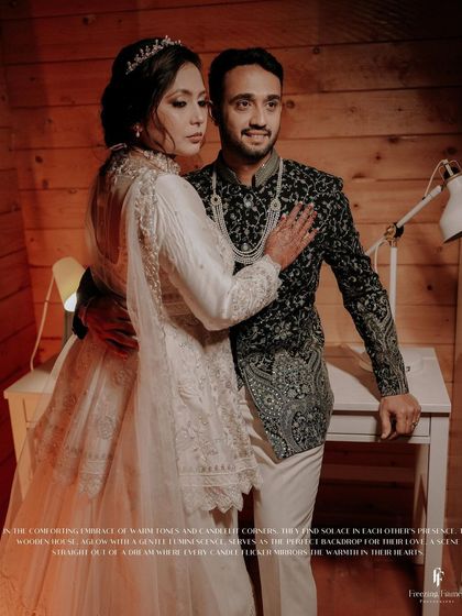 A full-length portrait of the couple in a cozy, wood-paneled room, with a caption describing the warm and intimate scene.