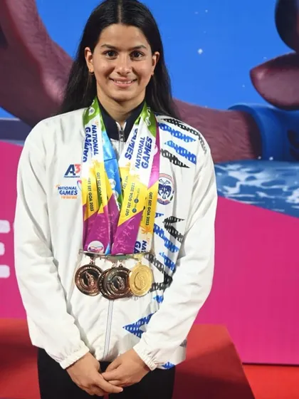 We train athletes to win. This is one of our national-level swimmers, showcasing the medals earned through relentless dedication and our expert coaching at the National Games.