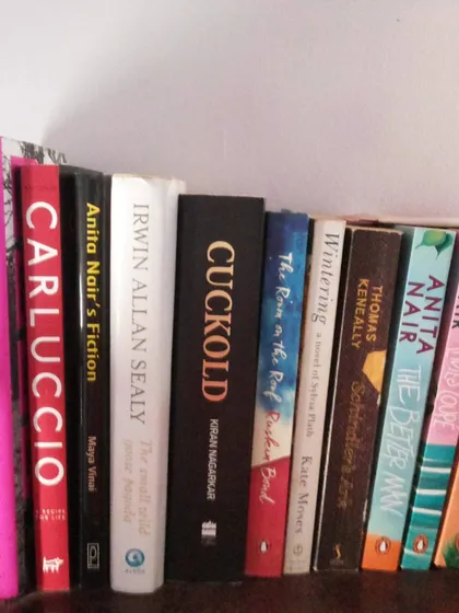 A personal shelf of books, featuring my own work alongside authors who have inspired me. A writer is first and foremost a reader, and happiness is a home filled with stories.